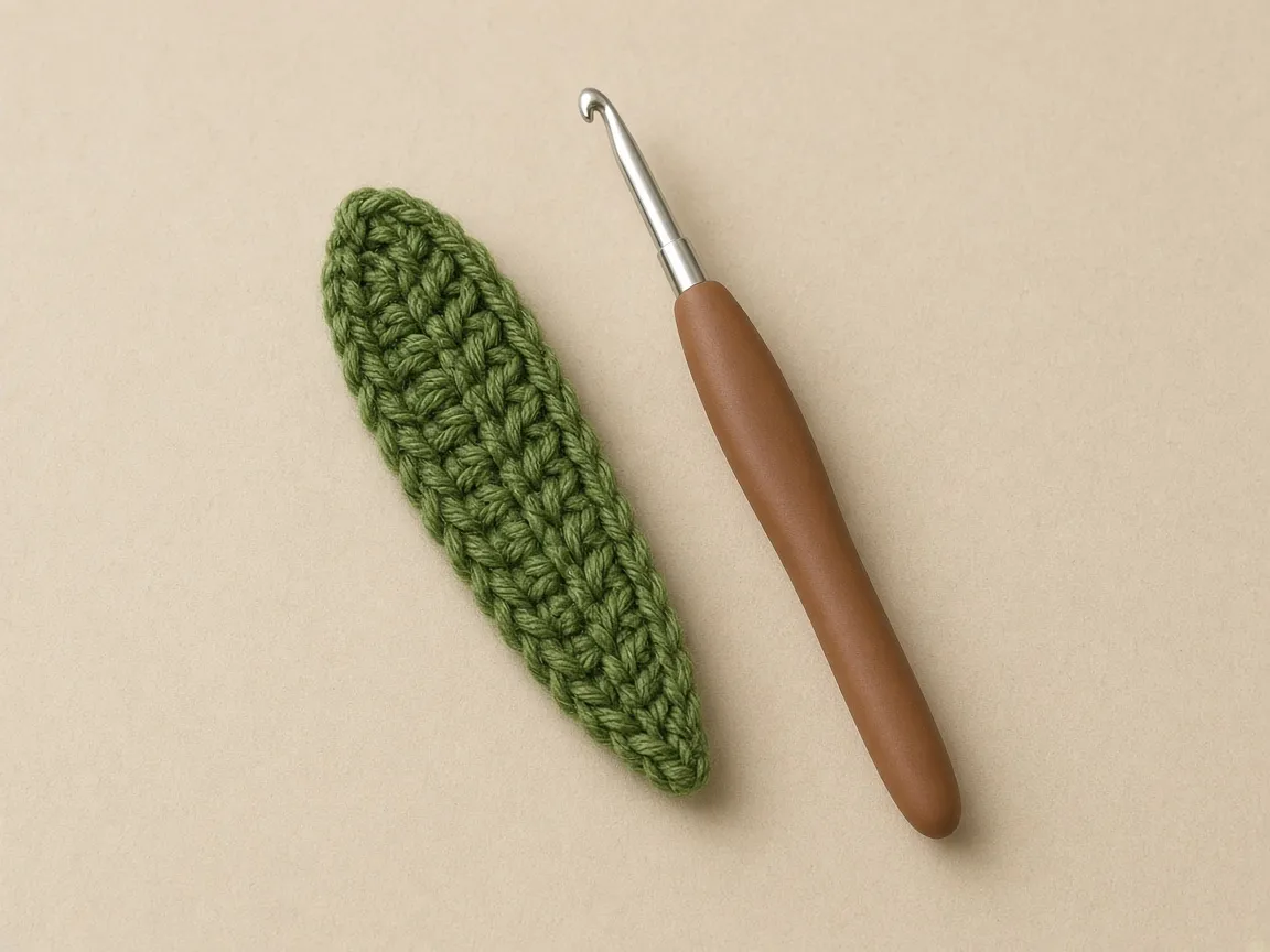 The leaf tab is a narrow green strip that ends in a point.